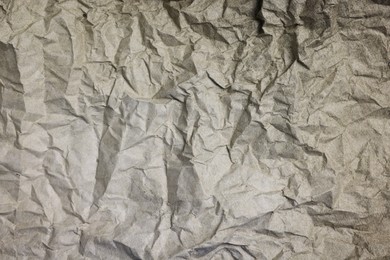 Texture of crumpled parchment paper as background, top view