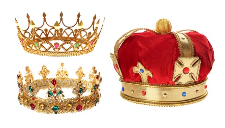 Set of crowns with gemstones on white background 