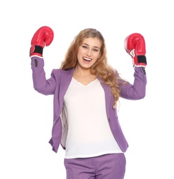 Photo of Happy young businesswoman with boxing gloves celebrating victory on white background