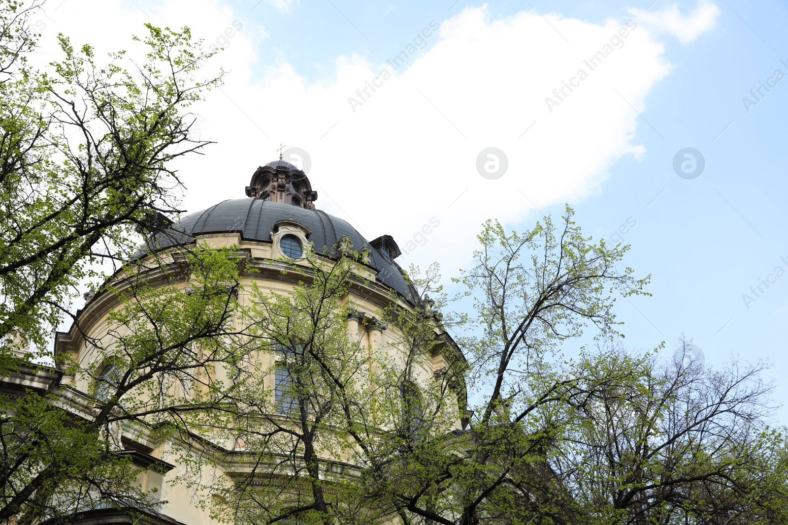 Photo of Exterior of beautiful cathedral against blue sky, low angle view