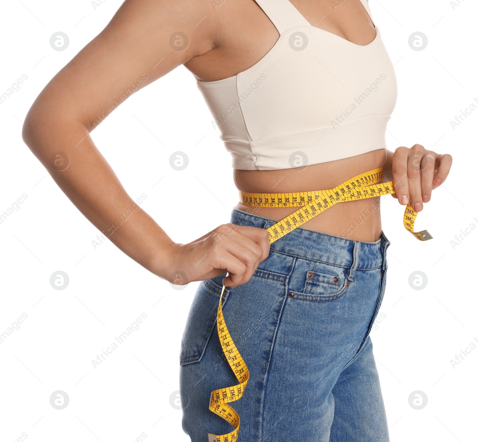 Photo of Woman measuring waist with tape on white background, closeup