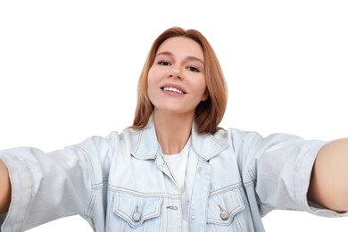 Beautiful woman taking selfie on white background