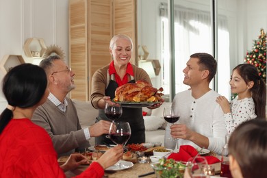 Happy family enjoying festive dinner at home. Christmas celebration