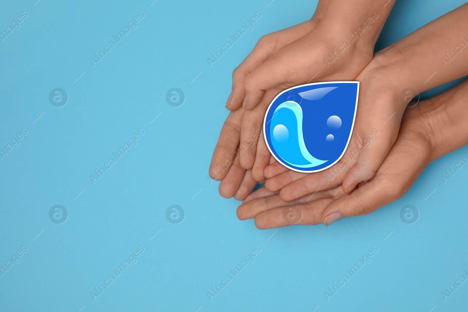 Image of Woman and girl holding paper water drop on blue background, top view. Space for text