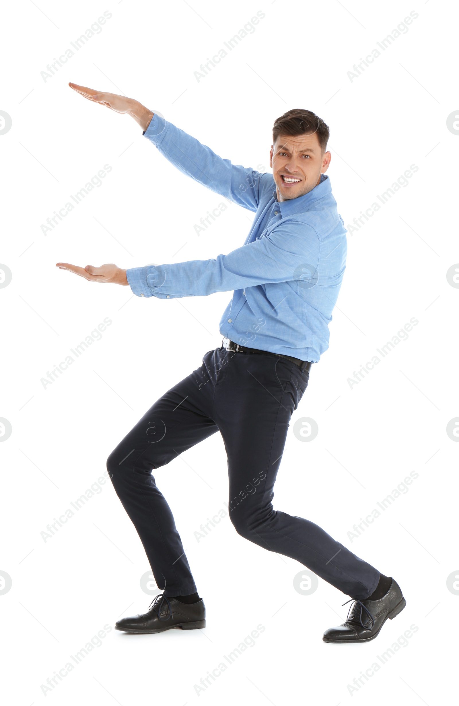 Photo of Emotional man in office wear holding something on white background