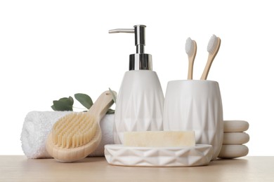 Bath accessories. Different personal care products and eucalyptus branch on wooden table against white background