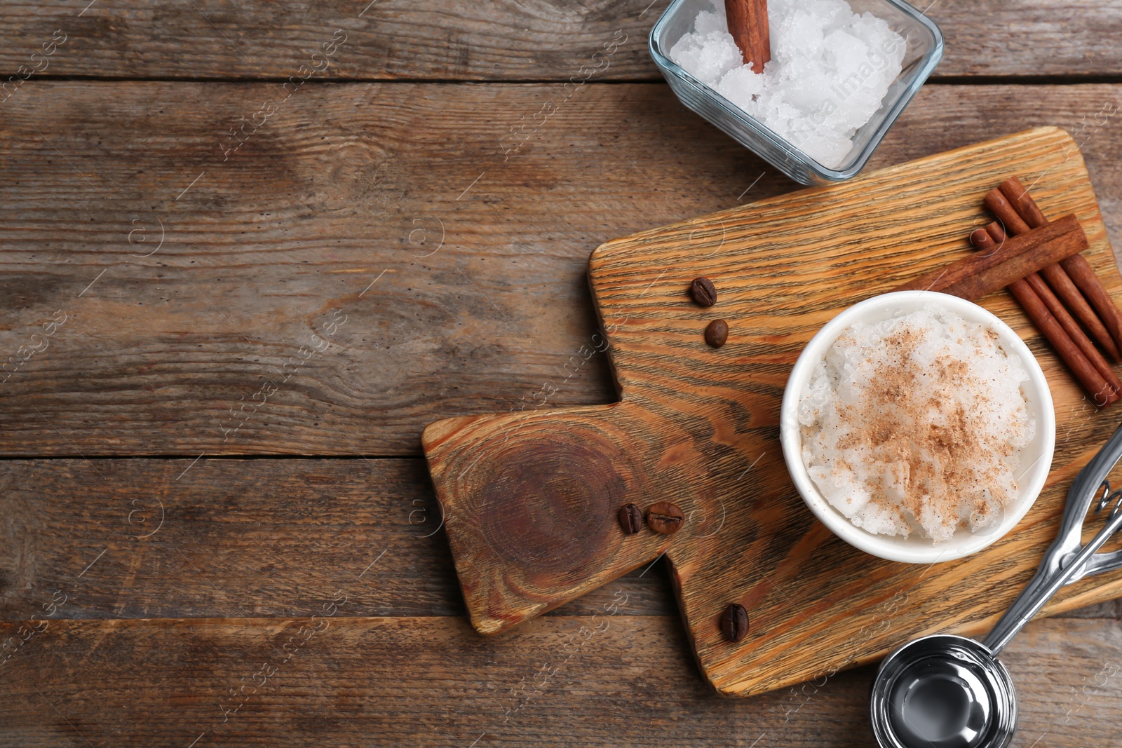 Photo of Flat lay composition with snow ice cream on wooden background. Space for text