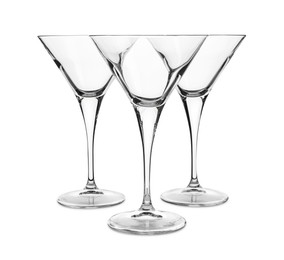 Photo of Elegant clean empty martini glasses isolated on white