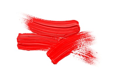 Red oil paint strokes on white background, top view