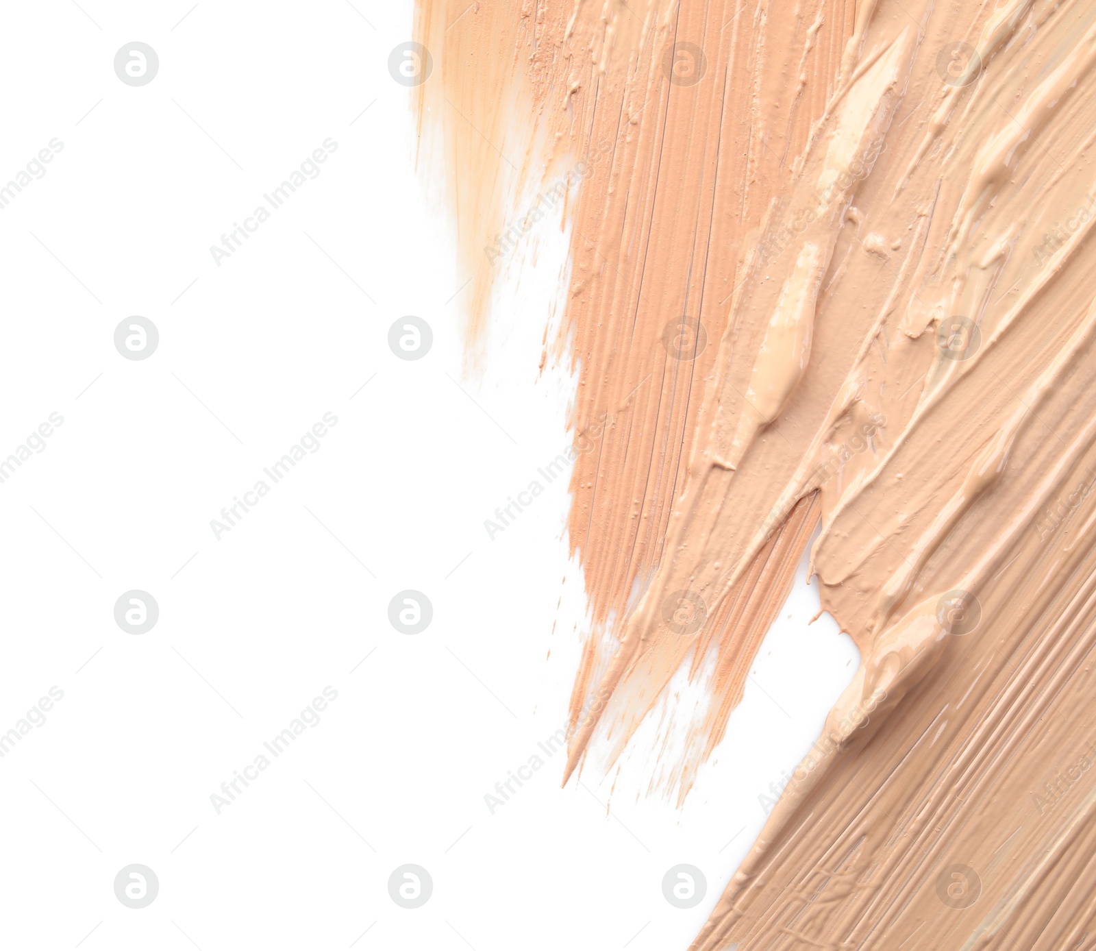 Photo of Samples of different foundation shades on white background, top view