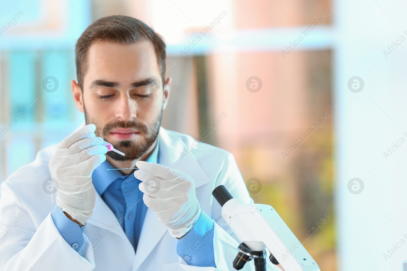 Photo of Young scientist working in laboratory, space for text. Chemical analysis