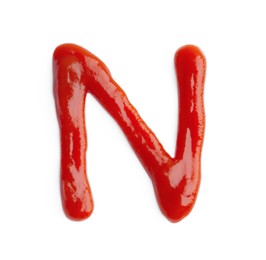 Photo of Letter N written with ketchup on white background