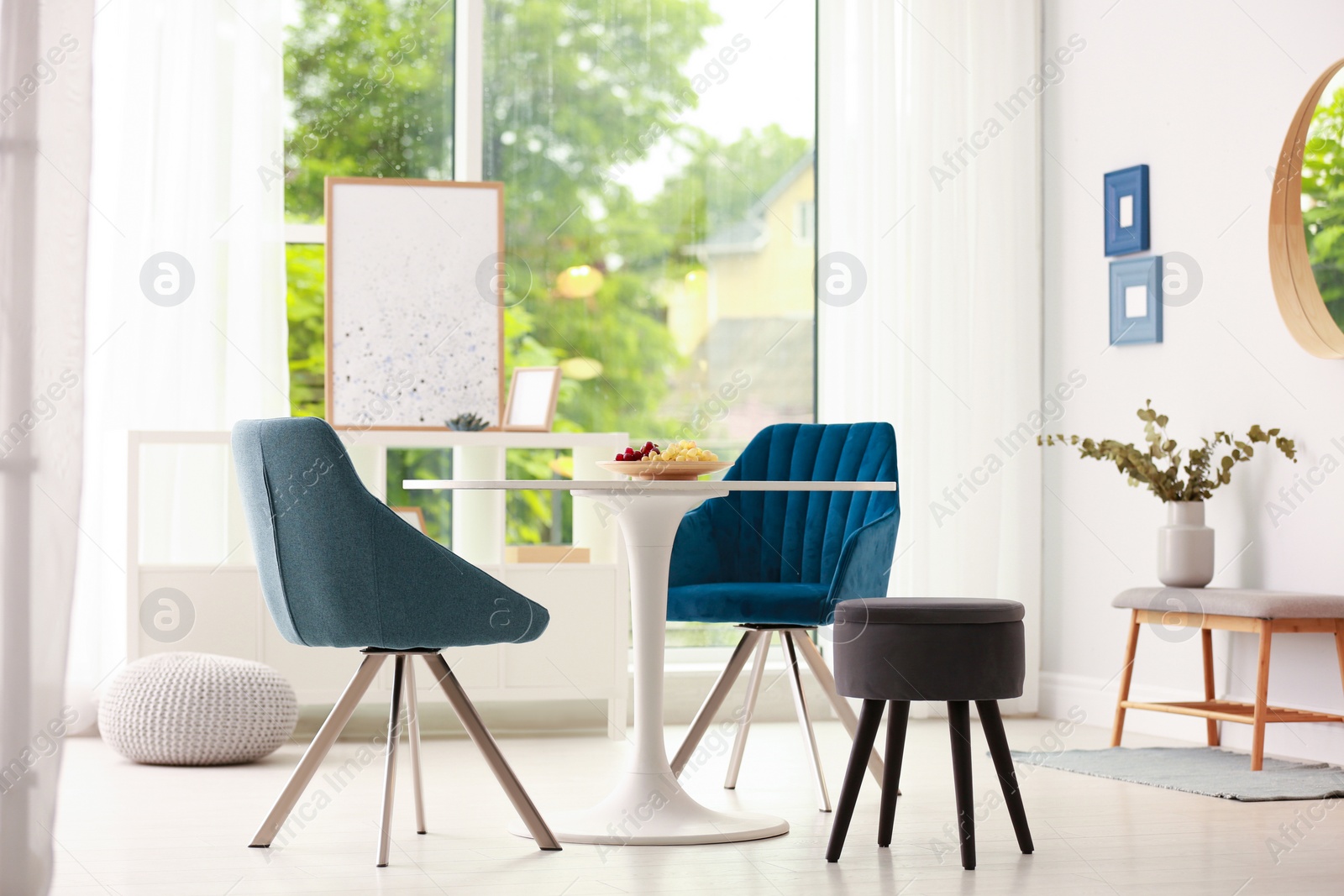 Photo of Modern dining room interior with table and chairs