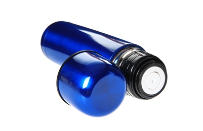 Photo of Blue metal thermos with lid isolated on white