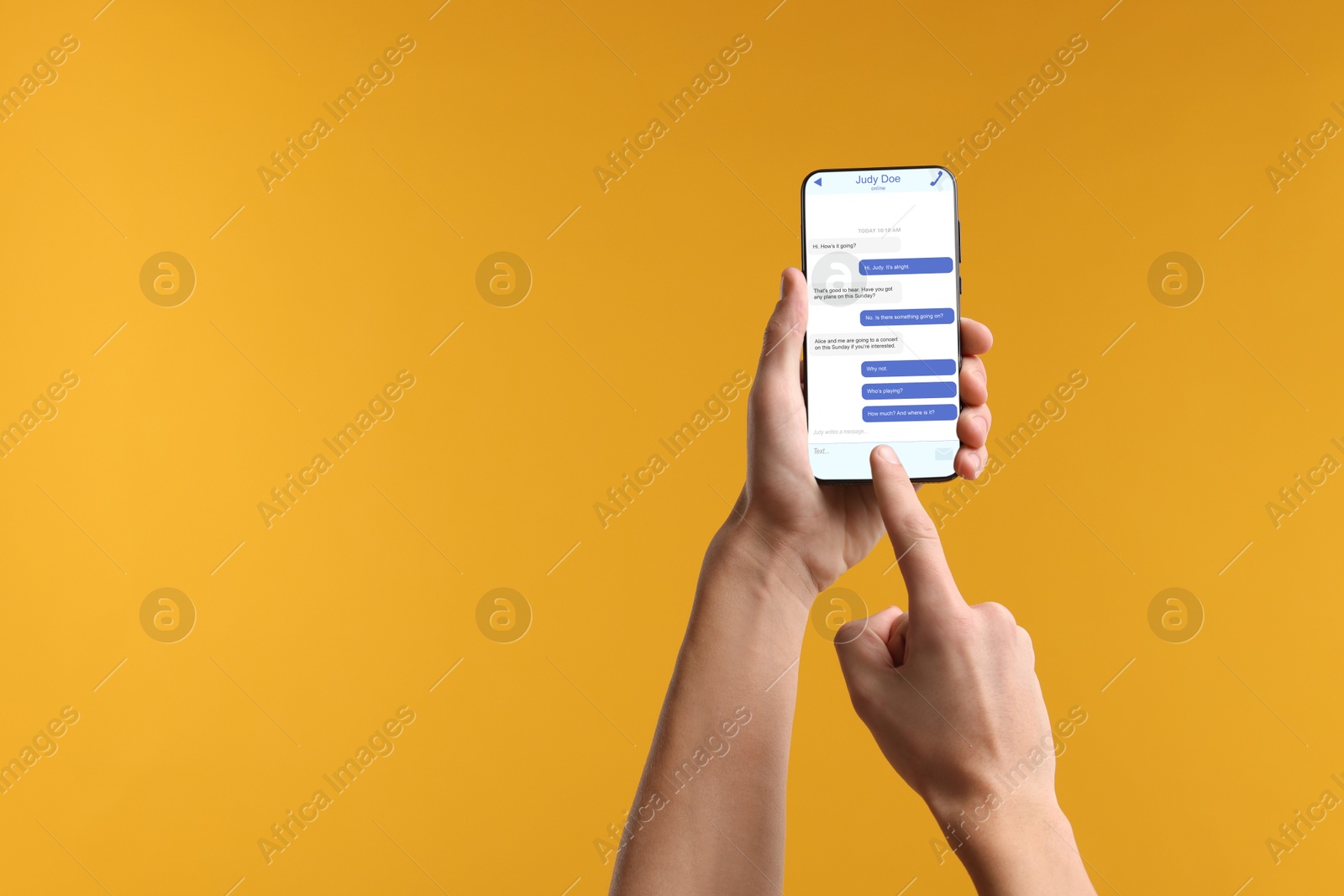 Image of Man texting via mobile phone on orange background, closeup. Device screen with messages