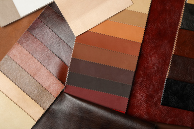 Photo of Different leather samples as background, flat lay