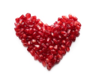 Heart made of pomegranate seeds on white background, top view with space for text