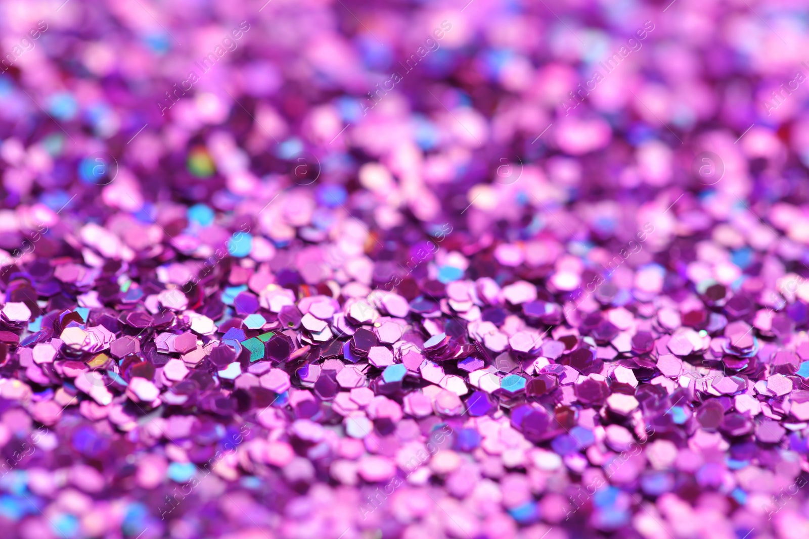 Photo of Many beautiful shiny paillettes as background, closeup