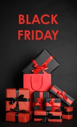 Many gifts and words Black Friday on dark background