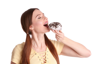 Beautiful young woman with donut on white background