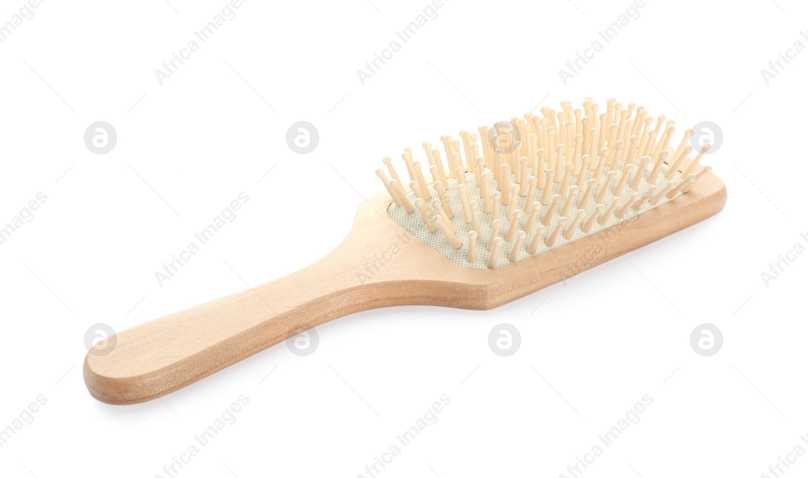 Photo of New wooden hair brush isolated on white