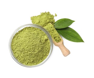 Photo of Henna powder in bowl, scoop and green leaves isolated on white, top view