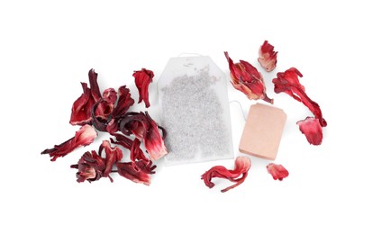 Photo of Bag with dry hibiscus tea isolated on white