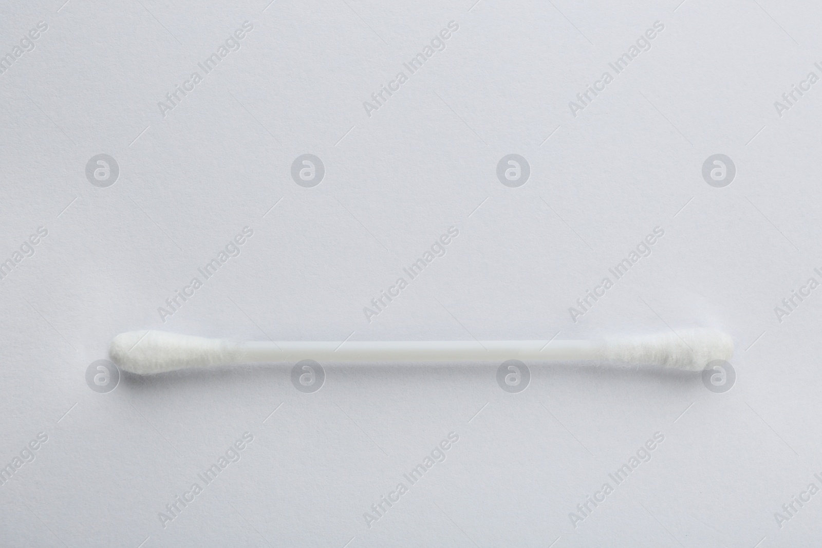 Photo of Plastic cotton swab on white background, top view