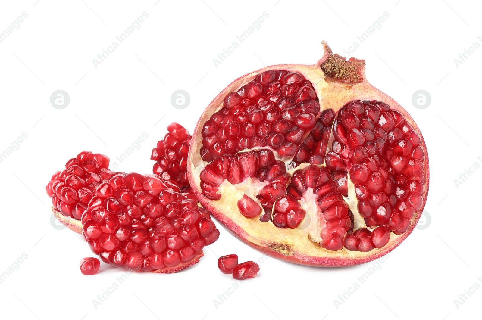 Photo of Fresh cut pomegranate with juicy seeds isolated on white