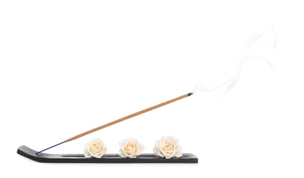 Photo of Incense stick smoldering in holder with roses on white background