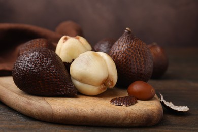 Photo of Fresh ripe salak fruits on table, closeup