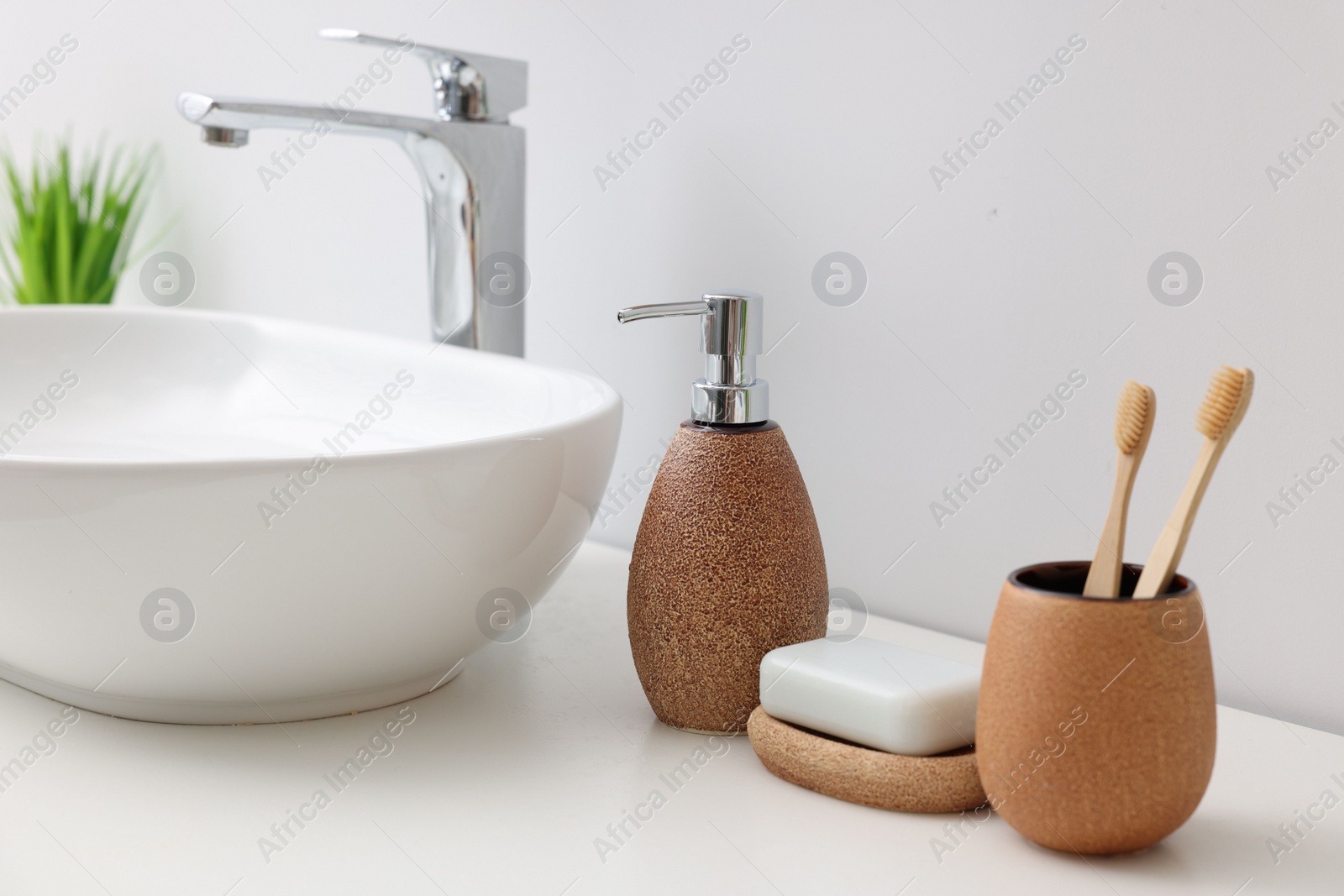 Photo of Set of different bath accessories and products on white table