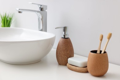 Photo of Set of different bath accessories and products on white table