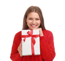 Happy young woman with Christmas gift on white background