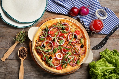 Flat lay composition with tasty homemade pizza on table