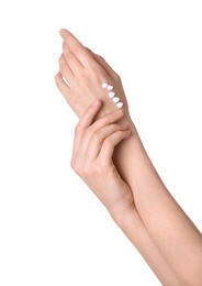 Photo of Young woman applying cream onto her hands on white background, closeup