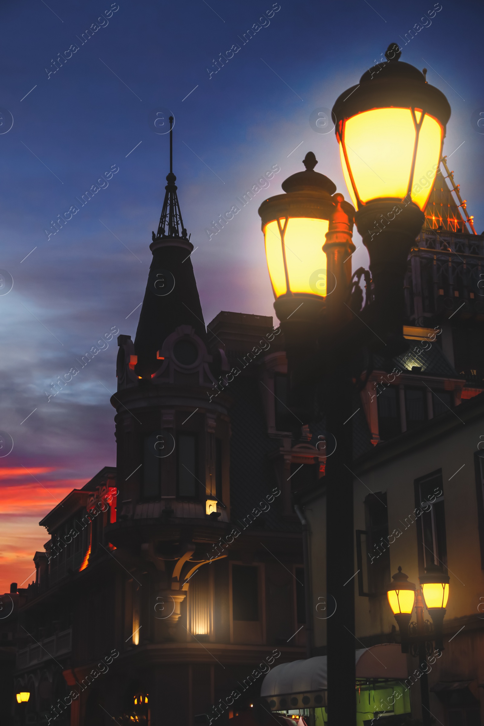 Photo of Beautiful cityscape with glowing streetlights in evening