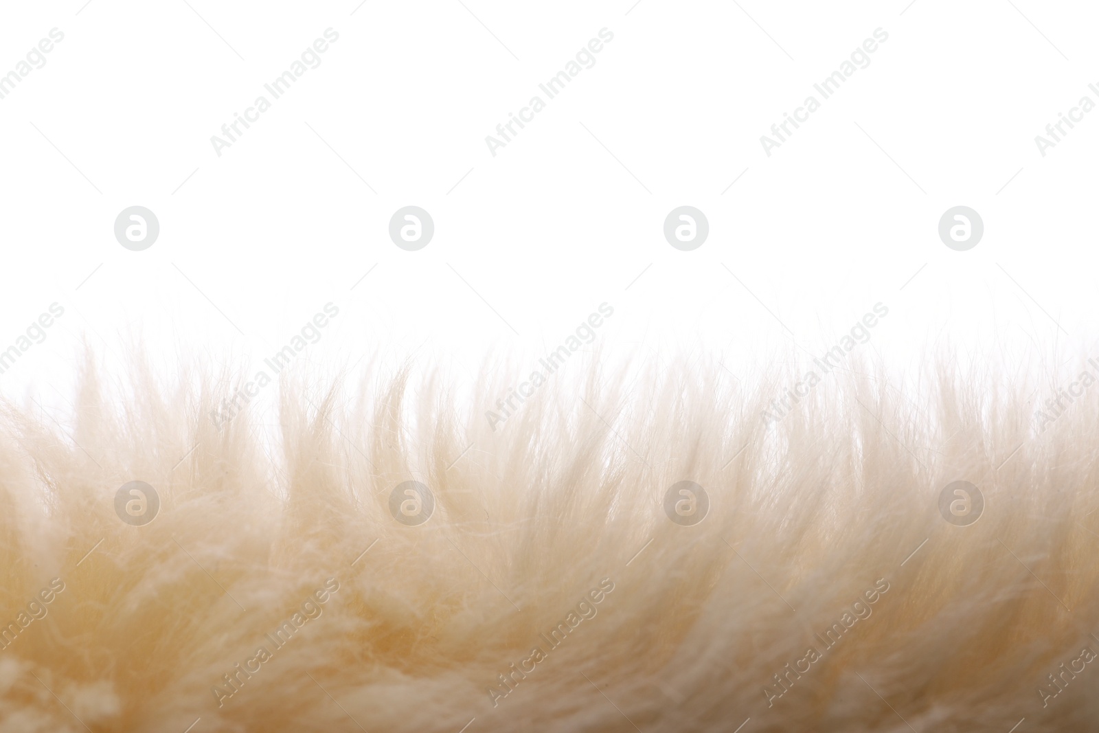 Photo of Soft beige faux fur isolated on white