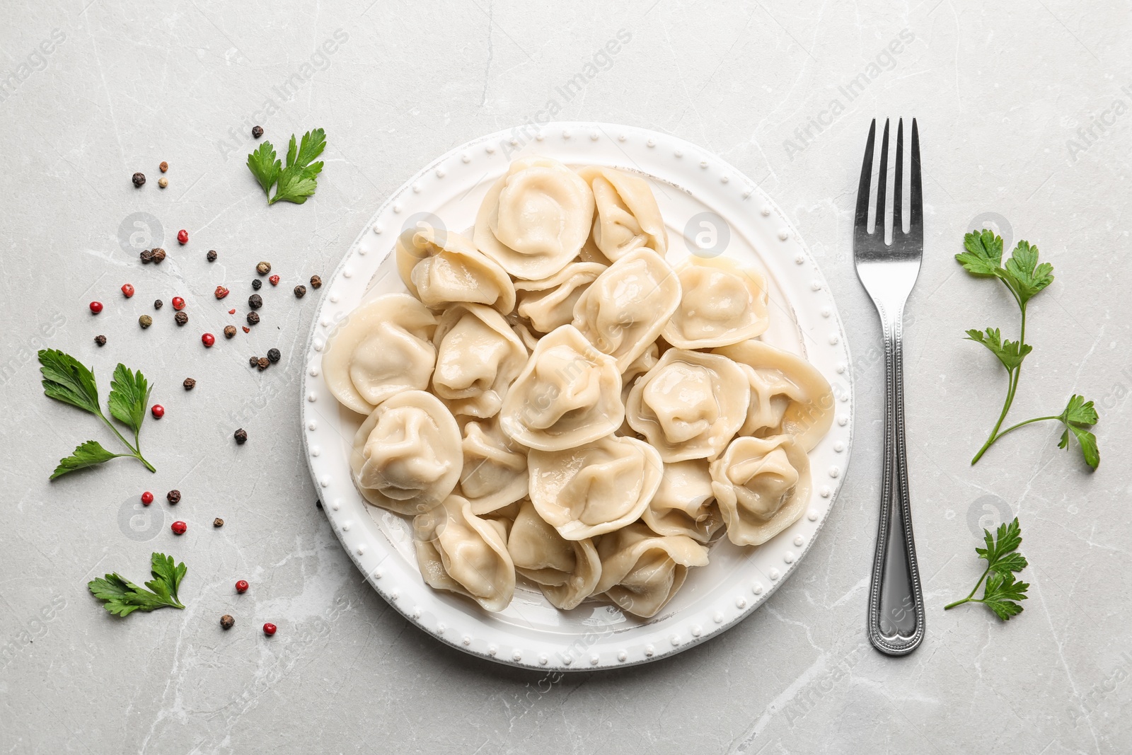 Photo of Flat lay composition with tasty dumplings on marble table