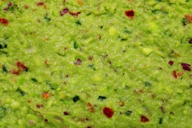 Photo of Delicious fresh guacamole as background, top view