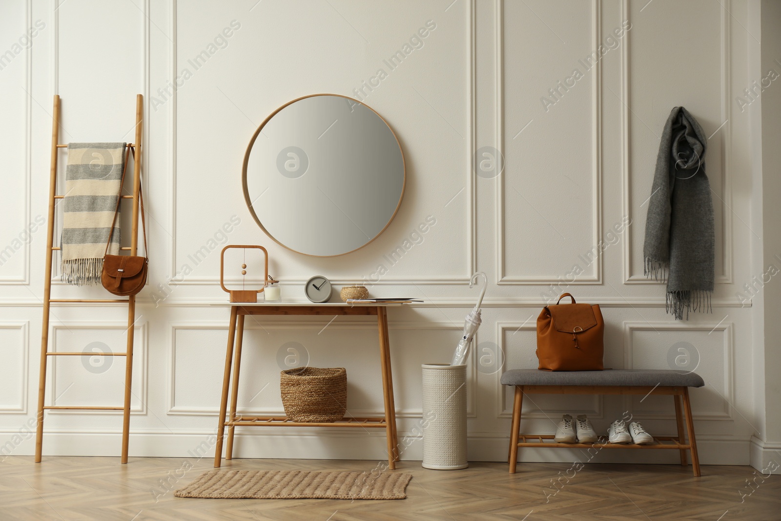 Photo of Hallway interior with stylish furniture, clothes and accessories