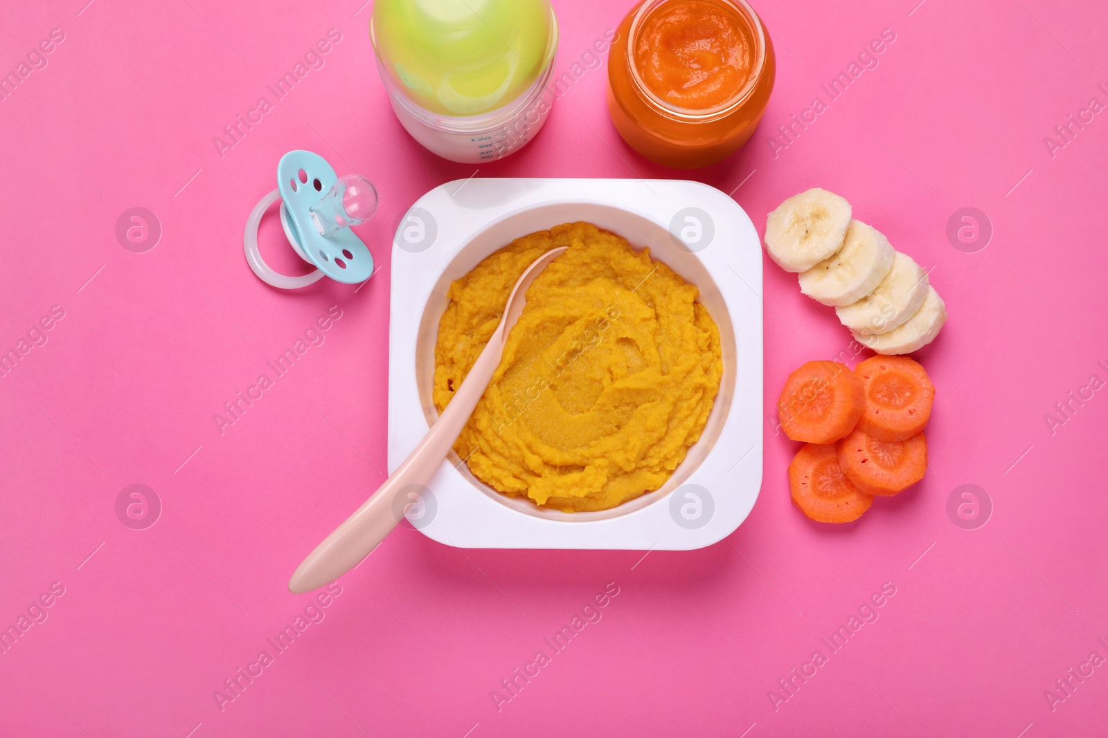 Photo of Flat lay composition with healthy baby food on pink background