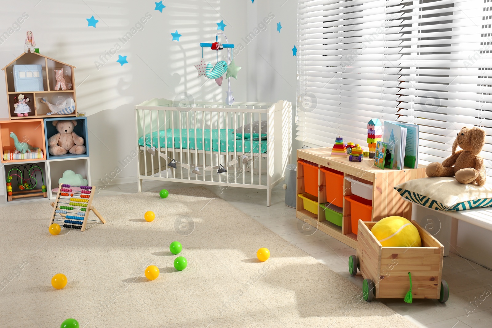 Photo of Cozy baby room interior with comfortable crib