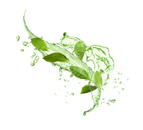 Image of Splashes of refreshing drink with leaves on white background. Green or matcha tea