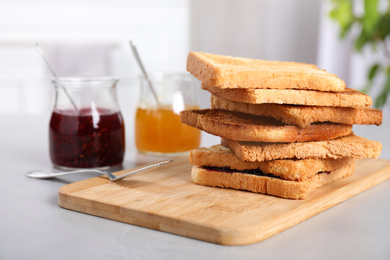 Toasts and jams for breakfast on table