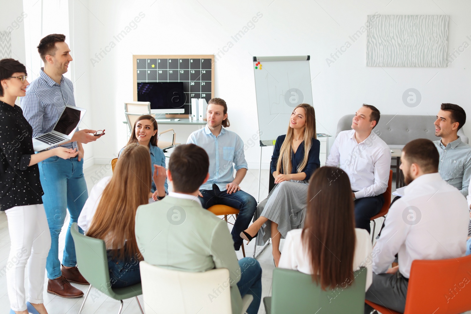 Photo of Young people having business training in office