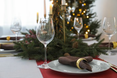 Beautiful table setting with Christmas decor indoors