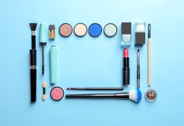 Flat lay composition with decorative cosmetics on color background