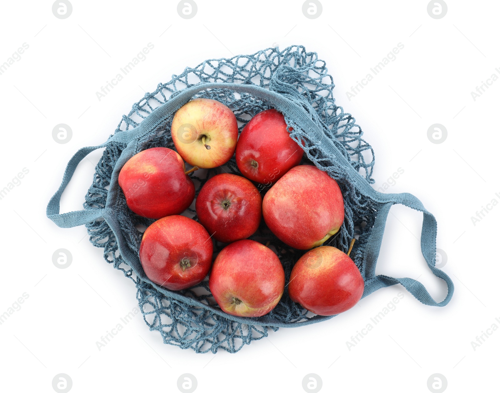 Photo of String bag with apples isolated on white, top view