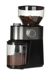 Photo of Modern electric coffee grinder with beans and powder isolated on white